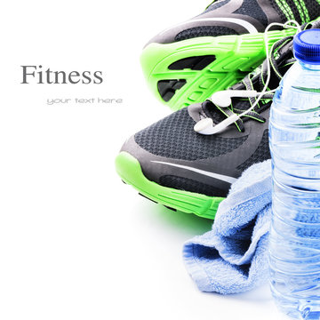Sport shoes and water bottle. Fitness concept