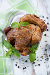 High angle view of a whole grilled spicy chicken, vertical shot
