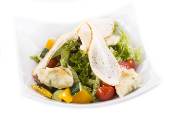 salad of meat cheese and vegetables in a restaurant