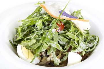 salad with eggs and vegetables on the table in a restaurant