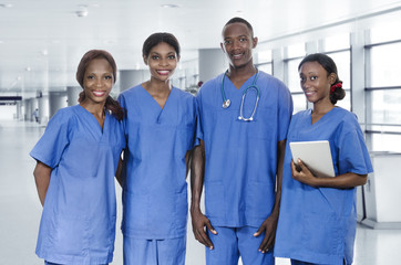 African physician team with tablet PC - 65594110