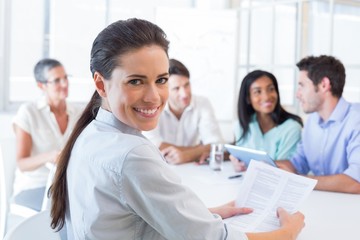 Attractive businesswoman smiling in the workplace