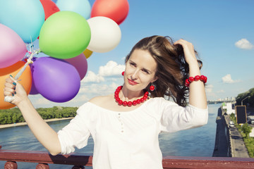 Young beautiful woman with balloons