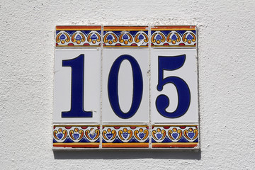 number one hundred and five, house address plate number