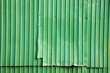 background from green metal wall in sun light