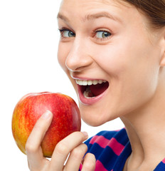 Young happy girl with apple