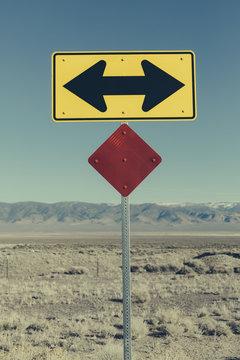 Directional arrow sign along rural road near Orvada.
