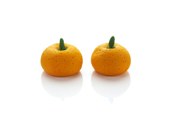 two orange model from clay on white background