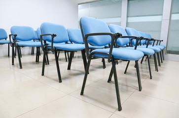 blue chairs in office meeting room