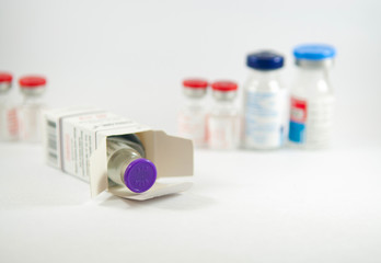 Closed up injection vial in box show medicine concept