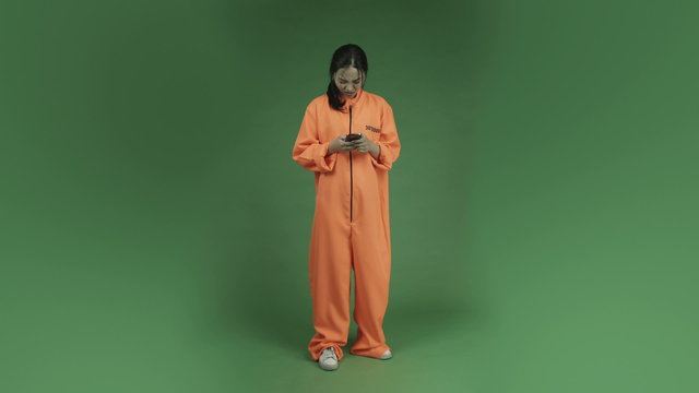young asian adult woman prisoner isolated on green-screen