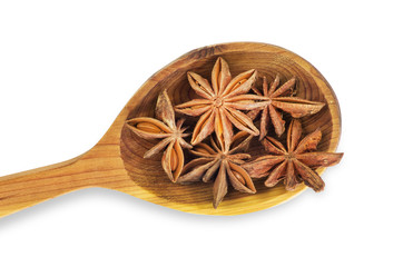 Star anise in wooden kitchen spoon