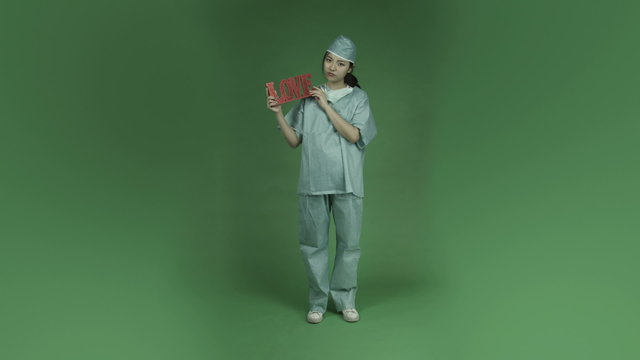 young asian adult woman doctor surgeon isolated on green-screen
