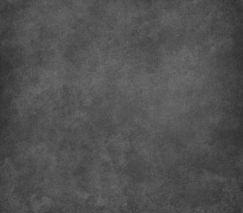 Black scratched grunge stucco wall background or texture
