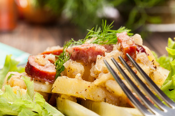 Scalloped potatoes with sausage and bacon