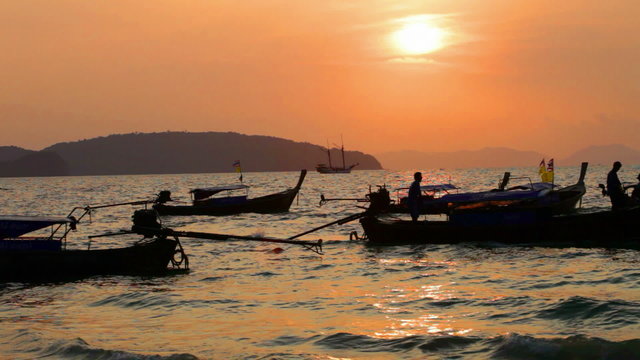 Traditional Thai boats on a sunset, Thailand