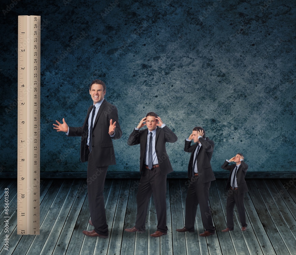 Poster Composite image of multiple image of angry businessman with rule