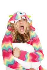 woman in colorful pajamas sit hold pillow scream