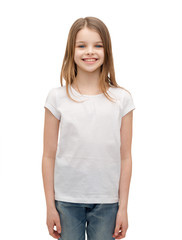 Fototapeta premium smiling little girl in white blank t-shirt