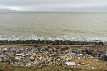 Fototapeta na wymiar February 14 Storm Damage 2014, wooden remains of smashed beach h