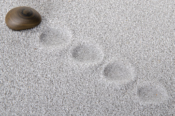 Pebble prints on the sand
