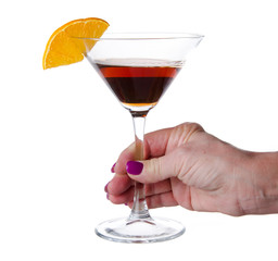 Woman's hand holding a cocktail glass