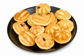 Thai dessert. egg cake raisin on the black dish