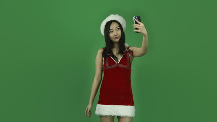 Asian girl sexy santa claus isolated greenscreen green