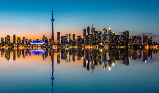 Toronto skyline at dusk reflected in the Inner Harbour Bay