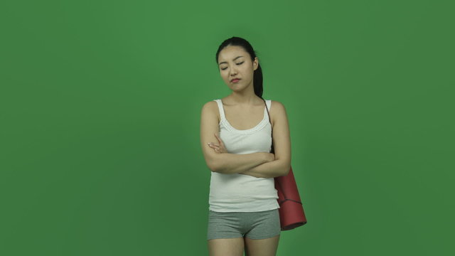 Asian sporty girl young adult isolated greenscreen green