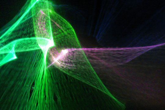 Abstract bent green and purple light pulse