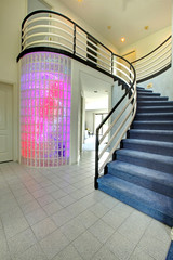 Modern foyer with glass block wall trim