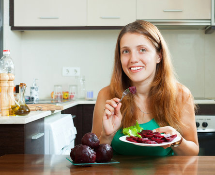 Ordinary Girl Eating Boiled Beets