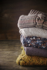Fototapeta na wymiar Stack of knitted sweaters