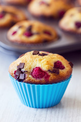 Blue tasty muffin placed on table