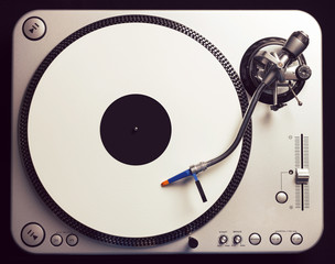 Old fashioned turntable playing a track