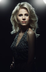 Naklejka premium Portrait of elegant woman in low key.