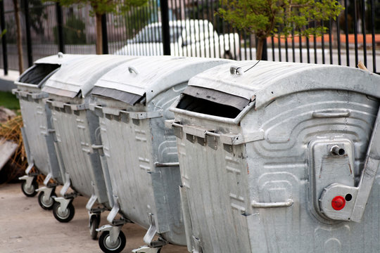 Trash cans in a row outdoors