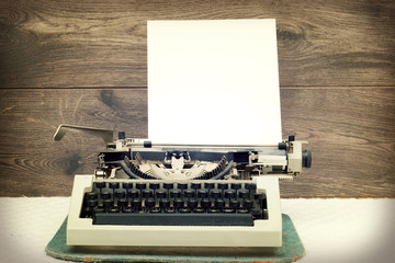 typewriter on wooden background