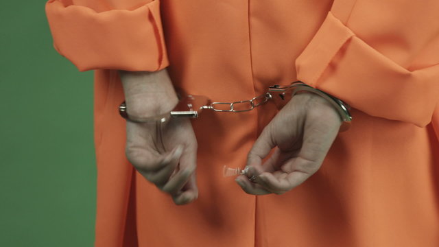 young asian adult woman prisoner isolated on green-screen