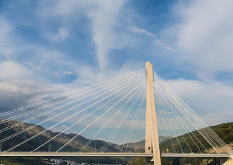 Fototapeta premium White Cables Over Span of Suspension Bridge