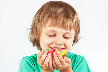 Child with sweets and colored jelly candies