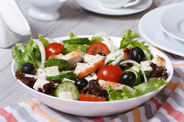 Salad with chicken, tomatoes, cucumbers, onions and cheese