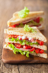 sandwich with ham tomato and lettuce