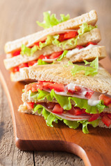 sandwich with ham tomato and lettuce