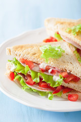 sandwich with ham tomato and lettuce
