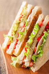 sandwich with ham tomato and lettuce