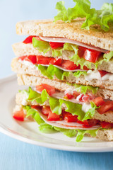 sandwich with ham tomato and lettuce