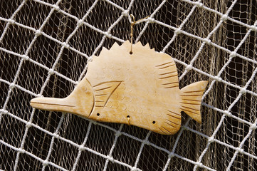 Two fishing nets and wooden fish