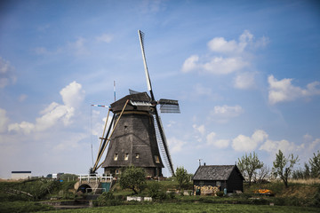 Picturesque landscape with windmills
